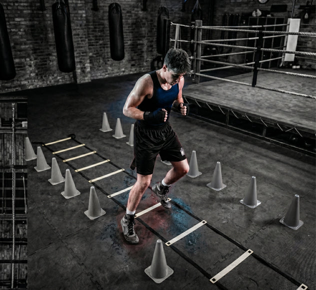 beginner boxer practicing boxing footwork drills and movement training in a gym