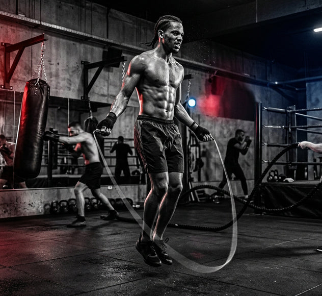 Boxing workout for weight loss showing heavy bag and cardio training session
