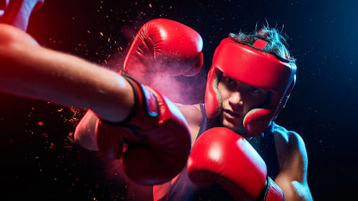 Boxer demonstrating defensive stance and boxing strategies during training